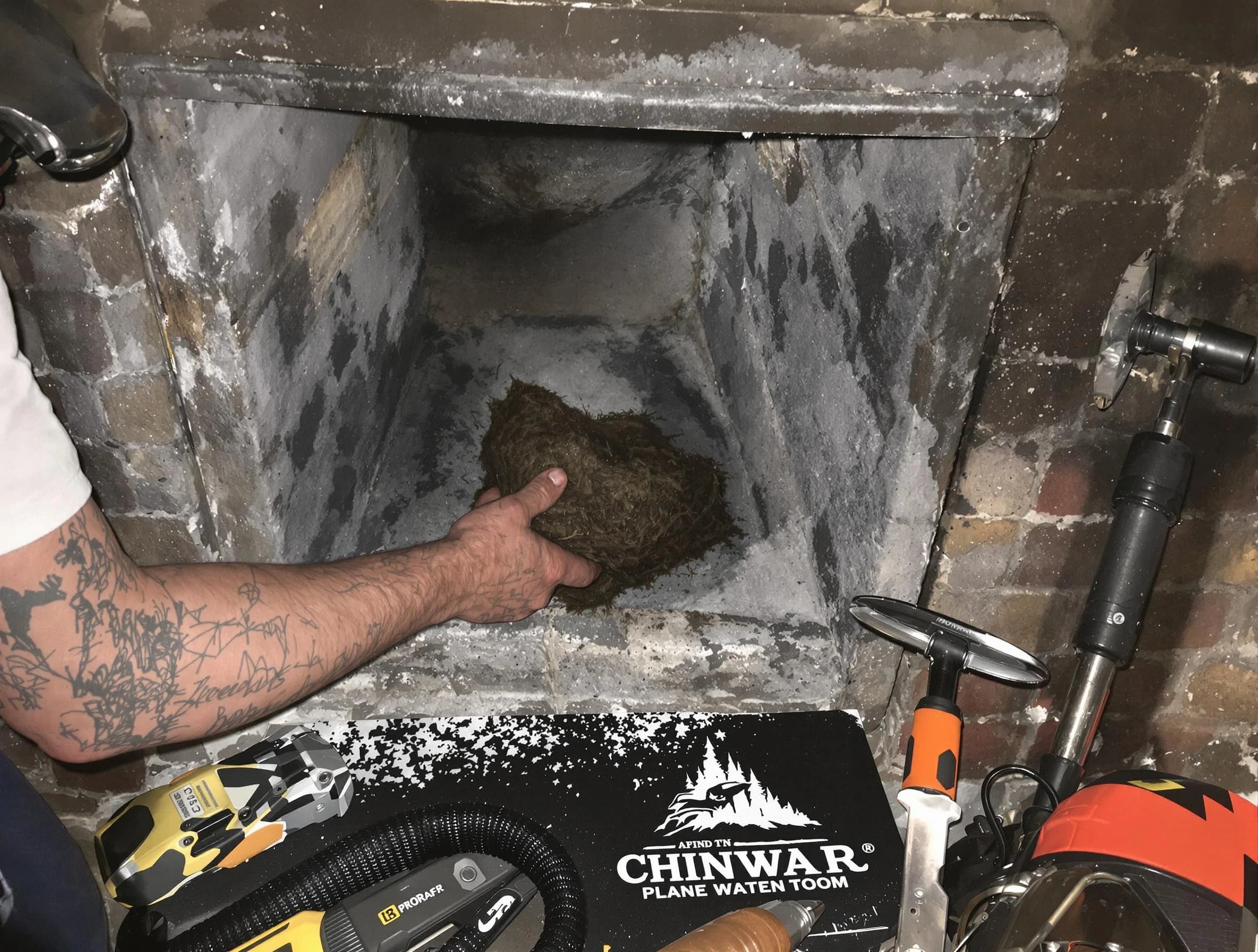 North Andover Chimney Sweep safely removing debris and screening chimney in North Andover, MA